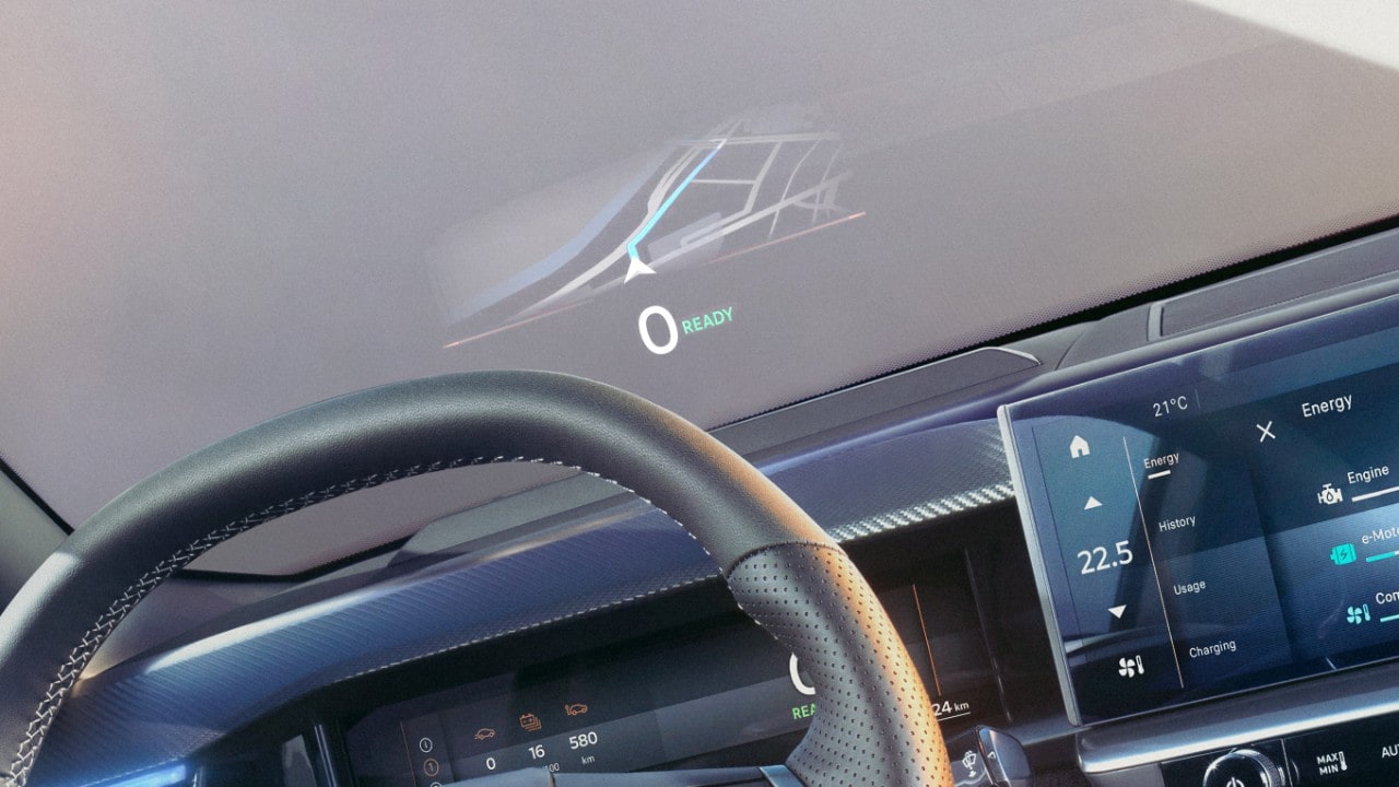 Close-up van het stuurwiel van een nieuwe Opel Grandland met zwart interieur en actief navigatiesysteem op de voorruit